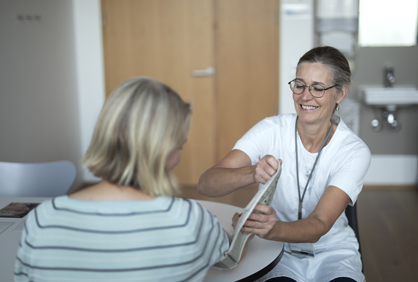 Billede af en konsultation med en sygeplejerske